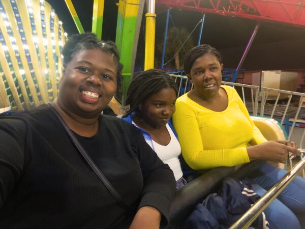 December Monthly Reset : Picture of me and my sister and niece on a rollercoaster ride 